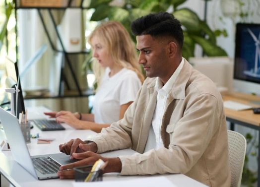 Staff working on a computer